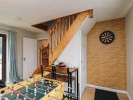 A snug with foosball table and dartboard at 1 Stanway Road
