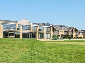 A building with balconies and large windows at Cotswolds Apartment, sleeps 4 in Chipping Norton