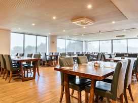 A dining room with tables and chairs at Cotswolds Apartments 2B/S4 in Chipping Norton