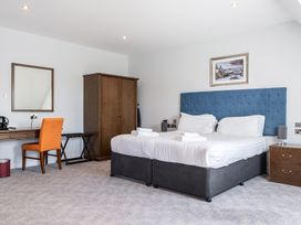 A bedroom with a bed and desk at Cotswolds Apartments 4B/S8 Chipping Norton