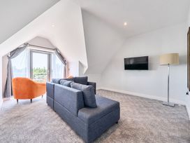 A living room with a sofa and armchair at Cotswolds Apartments 4B/S8 Chipping Norton