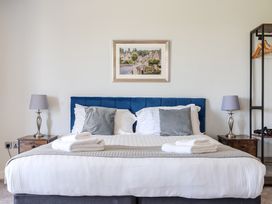 A bedroom with a bed and nightstands at Cotswolds Apartments 4B/S8 Chipping Norton