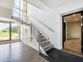 A staircase and doorway in a hallway at Cotswolds Apartments 4B/S8 in Chipping Norton