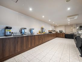 A kitchen with coffee machines and food service area at Cotswolds Apartments 4B/S8 Chipping Norton
