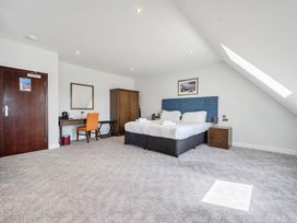A bedroom with a bed and a desk at Cotswolds Apartments 4B/S8 Chipping Norton