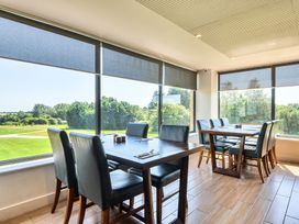 A dining room with tables and chairs at Cotswolds Apartments 4B/S8 in Chipping Norton