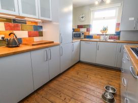 A kitchen with countertops and a kettle at Driftmark in Weymouth
