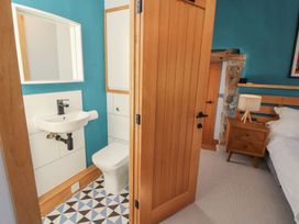 A bathroom with a sink and toilet at Haws Bank Cottage in Coniston