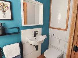 A bathroom with a sink and toilet at Haws Bank Cottage Coniston