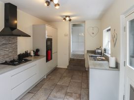 A kitchen with countertop and appliances at Conway Mart Cottage in Conwy