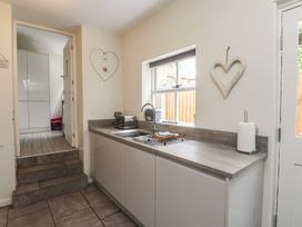 A kitchen with a sink and countertop at Conway Mart Cottage in Conwy