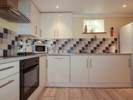 A kitchen with countertops, appliances and tiles at The Water Mill at Boyton Mill Launceston