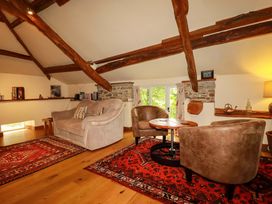A living room with a sofa and chairs at The Water Mill at Boyton Mill Launceston
