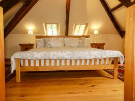 A bedroom with a bed and bedside tables at The Water Mill at Boyton Mill Launceston