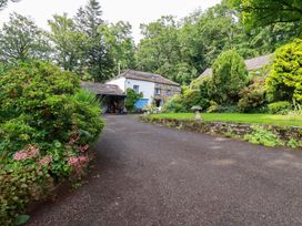 An outdoor area with a house and garden at The Water Mill at Boyton Mill Launceston