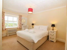 A bedroom with a bed and side tables at Ty Mawr in Criccieth
