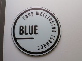 A sign indicating Four Wellington Terrace and Blue
