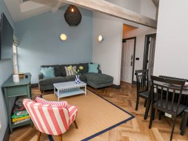 A living room with a sofa and coffee table at Apartment Blue in Whitby