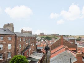 A view of rooftops and a landscape at Apartment Blue in Whitby