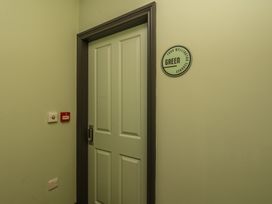 A door labeled Green in a hallway at Apartment Green in Whitby