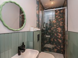 A bathroom with a shower and a sink at Apartment Green in Whitby