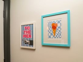 Framed artwork in a hallway at Apartment Yellow in Whitby