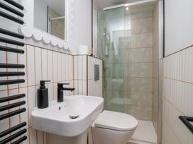 A bathroom with a shower and sink at Apartment Yellow in Whitby