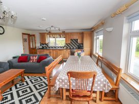 A dining room with a table and chairs at Islands Inn in Louisburgh, County Mayo