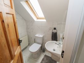 A bathroom with a toilet and sink at Islands Inn in Louisburgh, County Mayo
