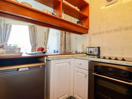A kitchen with cabinets and appliances at Chyancrowse in Penzance