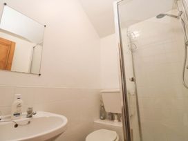 A bathroom with a shower and a sink at Chyandaunce in Penzance
