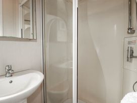 A bathroom with a sink and shower at Roslenn in St Agnes