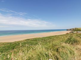 A beach with sand and ocean view at Roslenn St Agnes
