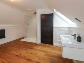 A bathroom with shower and basin at The Barn at Bryn Eithin Colwyn Bay