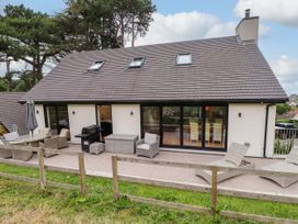 An outdoor area with seating and a grill at The Barn at Bryn Eithin Colwyn Bay