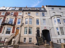 A building with balconies and stairs at Sea View Apartment in Whitby