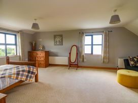 A bedroom with a bed and chest of drawers at Vernegly in Banonow