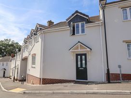 A residential building with a front door and windows at L'Ancresse Cottage in Lyme Regis