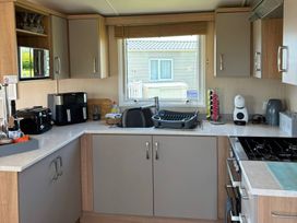 A kitchen with appliances and counter space at Primrose Valley Park - Pebbles Retreat, Primrose Valley