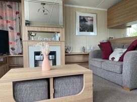 A living room with a sofa and coffee table at Primrose Valley Park - Pebbles Retreat, Primrose Valley