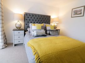 A bedroom with a bed and bedside tables at Gwelfor in Cemaes Bay