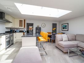 A kitchen with a dining area at Trefin Cemaes Bay