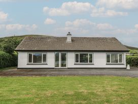 A house with multiple windows and a door at Tí Chonaill in 