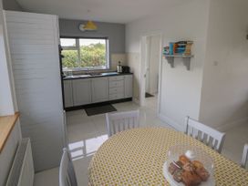 A kitchen with a table and pastries at Tí Chonaill 