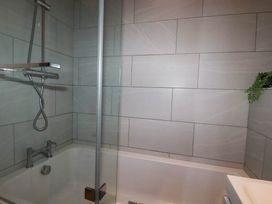 A bathroom with a bathtub and shower at Studio Room No.2 in Newquay