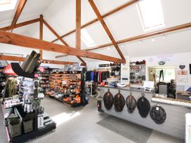 A retail store with shelves of tools and clothing at Caravan in Dolton