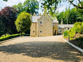 A house with a driveway and garden at Chowdene Lodge Estate 