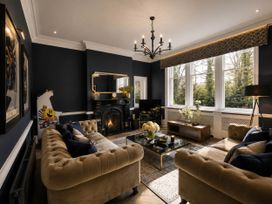 A living room with a sofa and coffee table at Chowdene Lodge Estate