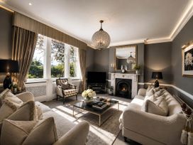 A living room with a sofa and coffee table at Chowdene Lodge Estate