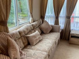 A living room with a sofa and cushions at an unspecified location